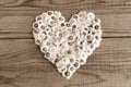 Heart made of daisies flowers in wooden background Royalty Free Stock Photo