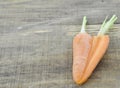 Heart made of double cut carrots on wooden Royalty Free Stock Photo