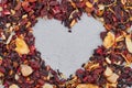 Heart made of dried hibiscus tea with fruits. Royalty Free Stock Photo