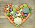 Heart made fresh vegetable on wooden; closeup
