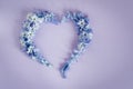 Heart made from hyacinths blossoms purple background. Royalty Free Stock Photo