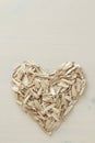 A heart made by lot of sunflower seeds. Pile of waste from seeds