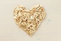 A heart made by lot of sunflower seeds. Pile of waste from seeds