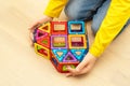 Heart made from magnetic building blocks of construction set in child hands