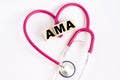 A heart made out of a stethoscope and wooden cubes with letters AMA American Medical Association Royalty Free Stock Photo