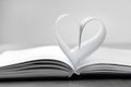 Heart made of paper sheets on book Royalty Free Stock Photo