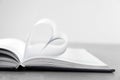 Heart made of paper sheets on book Royalty Free Stock Photo