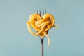 Heart made with pasta on fork. Swirl of spaghetti shaped as a heart. Pasta love, Italian cuisine. Copy space, design element for Royalty Free Stock Photo