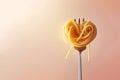 Heart made with pasta on fork. Swirl of spaghetti shaped as a heart. Pasta love, Italian cuisine. Copy space, design element for Royalty Free Stock Photo