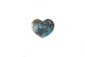 Heart made of precious stone in front of white background