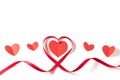 Heart made of red ribbon on white background.