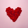 Heart made from red rose petals isolated on pink background Royalty Free Stock Photo