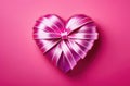 Heart made of ribbon on contrast pink background, Valentine\'s Day