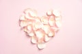 Heart made of rose petals on pink background. Happy Valentines Day concept Royalty Free Stock Photo