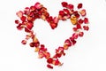 Heart made of rose petals. Red rose petals heart over white background Royalty Free Stock Photo