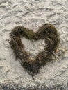 Heart made of seaweed at sandy Beach