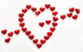 Heart made with small hearts, crossed by an arrow of more hearts. Concept of love, passion, affection, Valentine`s day, Valentine