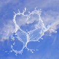 Heart made from splashed water on blue sky background. Better times/weather for gay people. Rainbow Colours Gay Lesbian. Royalty Free Stock Photo