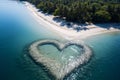 A heart made of stones covered with water on the beach, view from a drone. Heart as a symbol of affection and love Royalty Free Stock Photo