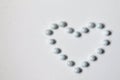 heart made of white beads on a white background. World Heart Day. love, donation, family insurance Royalty Free Stock Photo