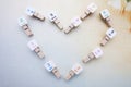 Heart made by wooden clips arrangement Royalty Free Stock Photo