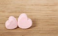 Heart Marshmallows over wood background