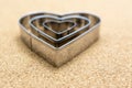 Heart, metal shape on pressed corkwood background. Conceptual photo