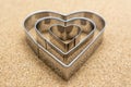 Heart, metal shape on pressed corkwood background. Conceptual photo