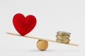 Heart and money on balance scale - Concept of money priority in life