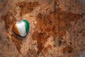 Heart with national flag of cote divoire on a vintage world map crack paper background. Royalty Free Stock Photo