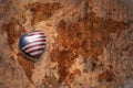 Heart with national flag of united states of america on a vintage world map crack paper background. Royalty Free Stock Photo