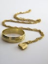 Heart necklace and wedding ring Royalty Free Stock Photo