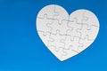 Heart object made of puzzle pieces. Make complete heart. Jigsaw puzzle pieces in form of heart. Happy Valentines Day, greeting