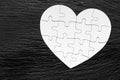 Heart object made of puzzle pieces. Make complete heart. Jigsaw puzzle pieces in form of heart. Happy Valentines Day, greeting