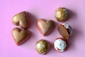 Heart and Octagon shaped chocolate on a pink background