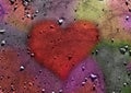Heart over colored sand and rocks background