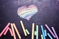 Heart painted with rainbow-colored chalk on a blackboard Royalty Free Stock Photo