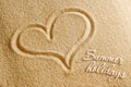 The heart is painted in the sand. Beach background. Top view. The concept of summer, summer kanikkuly, vacation, holydays