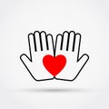 Heart on the palms. Charity symbol.