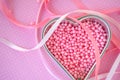 Heart pan with pink beads on polka dots Royalty Free Stock Photo