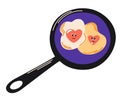 Heart-shaped fried eggs in a frying pan. Fried egg in the shape of a heart Valentine Day lovers breakfast. Royalty Free Stock Photo