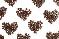 Heart pattern of heap roasted coffee beans isolated on white background.