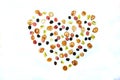 Heart pattern made from minipancakes, grapes and kiwi on a white background. Dessert Royalty Free Stock Photo