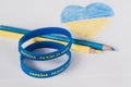 Yellow-blue bracelets with an inscription in Ukrainian: