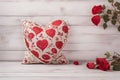 heart pillow with rose pattern on white vintage wooden background Royalty Free Stock Photo