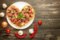 Heart pizza love concept Valentines day romantic dinner Italian pastries. on a wooden table. Flat-lay