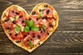 Heart pizza love concept Valentines day romantic dinner Italian pastries. on a wooden table. Flat-lay