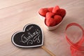 Heart poster with message and sweets in container elevated view