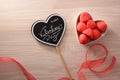 Heart poster with message and sweets in container top view