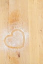 Heart prints and drawing with flour on the board.